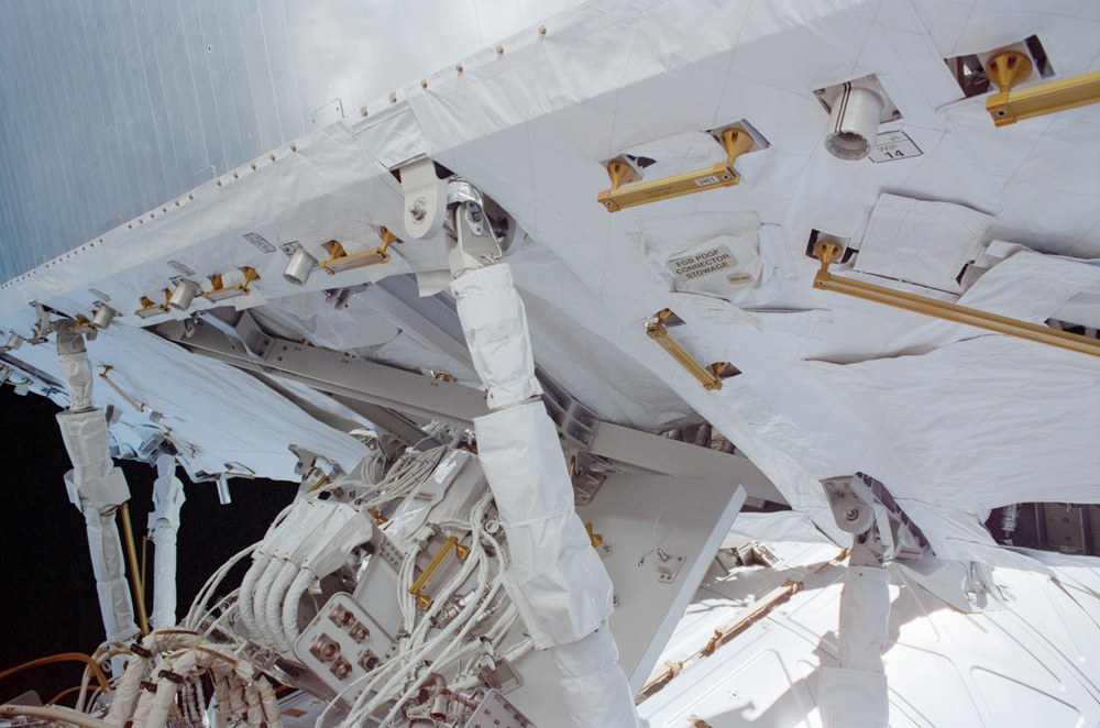 View of the aft avionics tray between the Z1 and S0 Trusses taken during the fourth EVA of STS-110