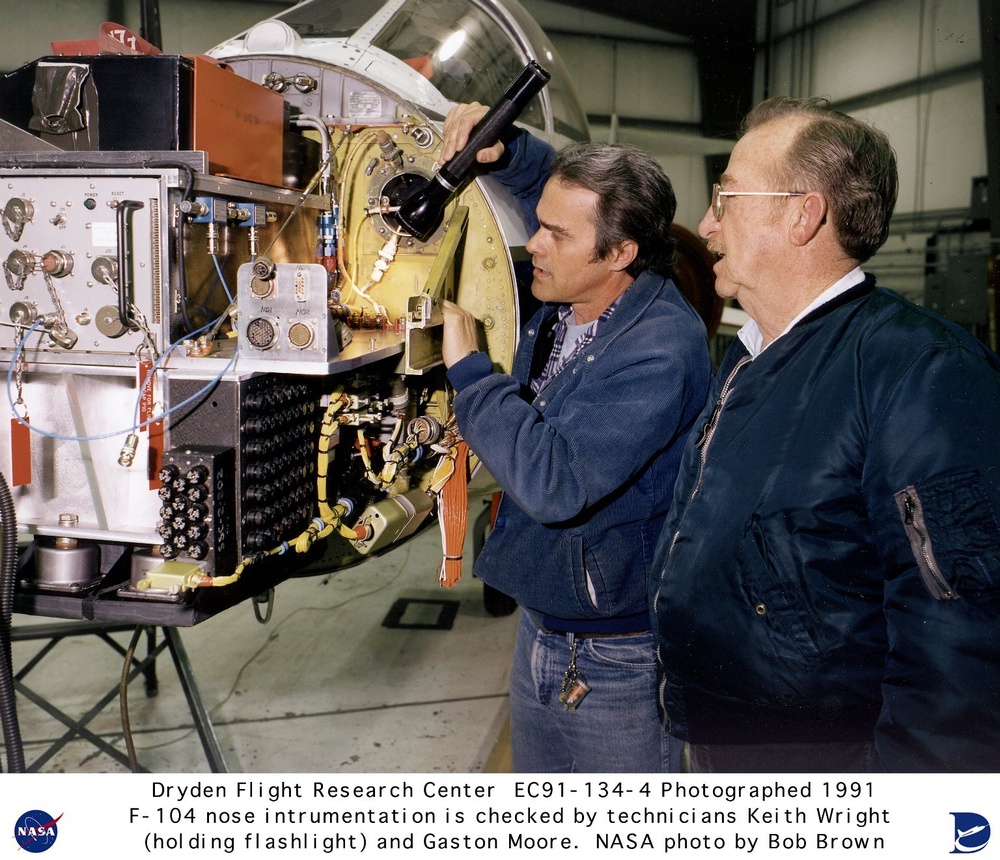 F-104 instrumentation is checked by Keith E. Wright and Gaston A. Moore