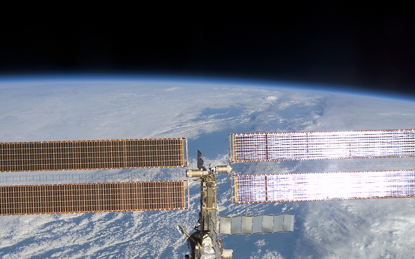 The aft - zenith side of the ISS taken during the STS-108 undocking and flyaround