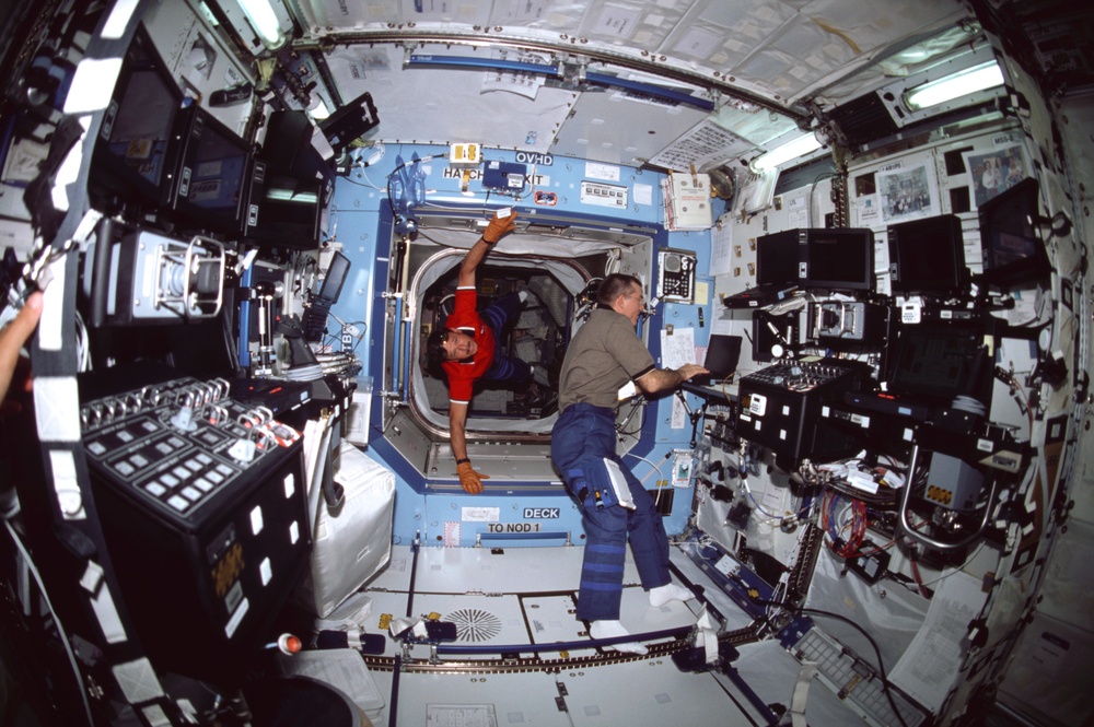 Horowitz floats into the ISS U.S. Laboratory/Destiny module where Voss is typing