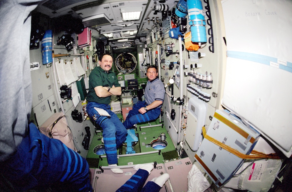 Usachev and Lonchakov in Zvezda during STS-100's visit to the ISS