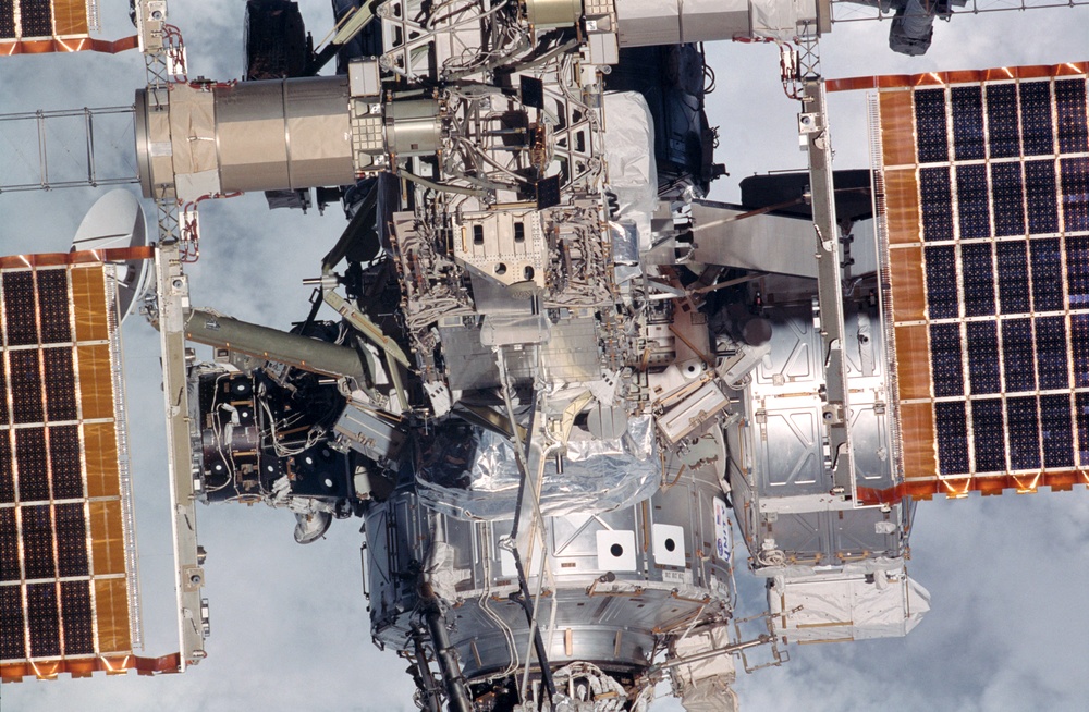 Exterior view of ISS during flyaround by STS-105 showing Node 1, P6 and Z1 trusses