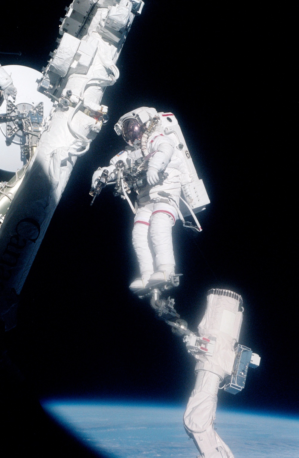 MS Hadfield works on the SSRMS during the first EVA of STS-100