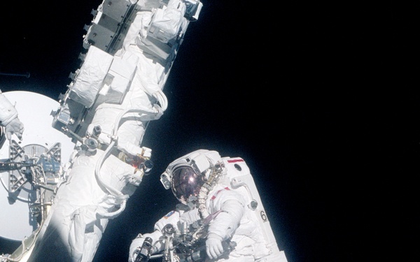 MS Hadfield works on the SSRMS during the first EVA of STS-100