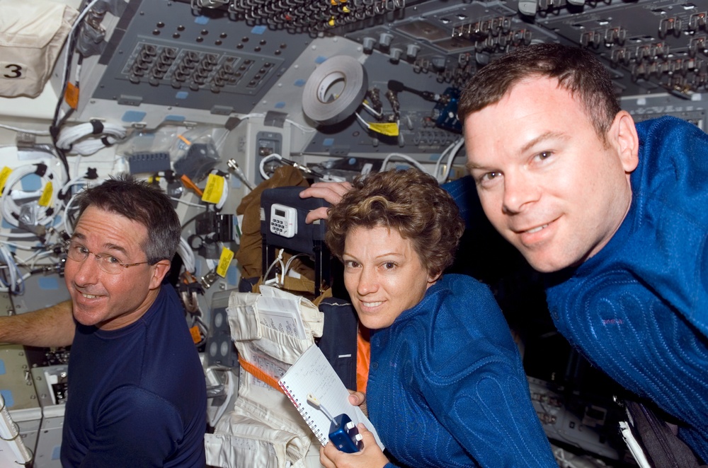 STS-114 crew on Discovery's flight deck