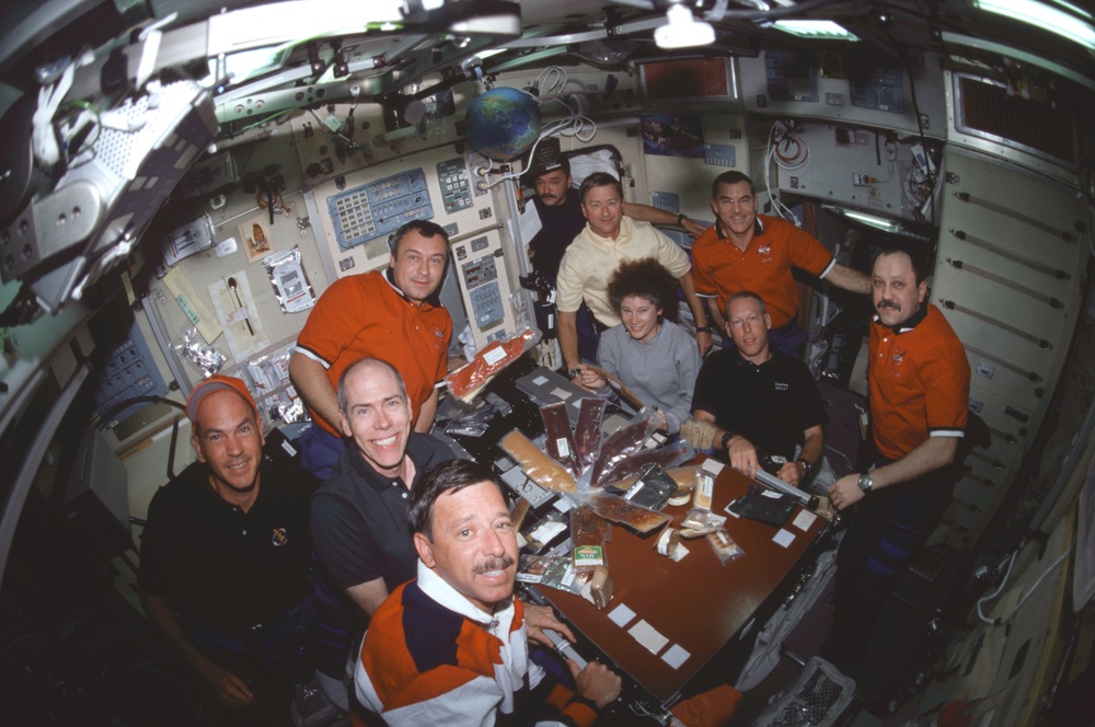 Meal time in the ISS Service Module/Zvezda with all three crews