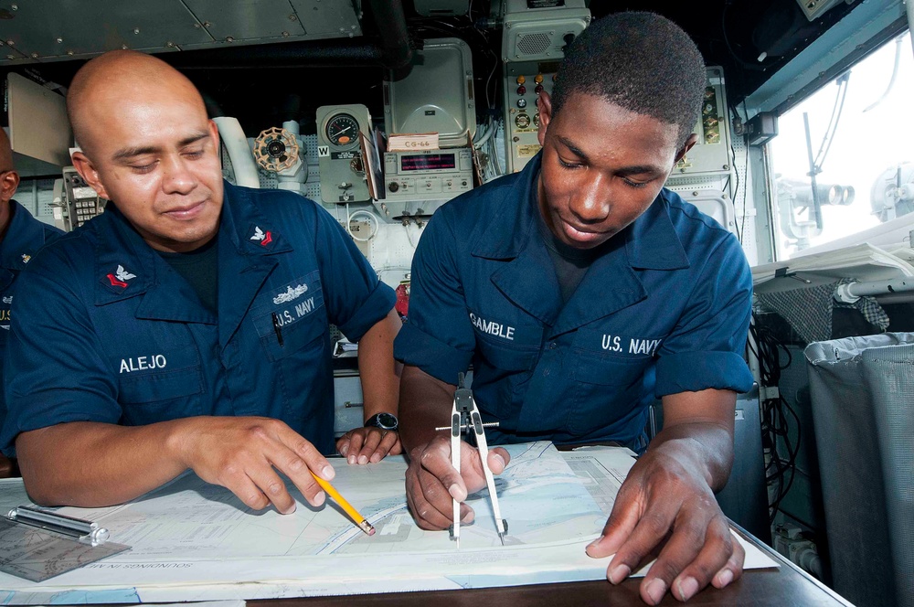 USS Hue City sailors plot coordinates