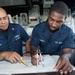 USS Hue City sailors plot coordinates