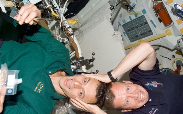 Candid views of Lindsey and Duque on the middeck