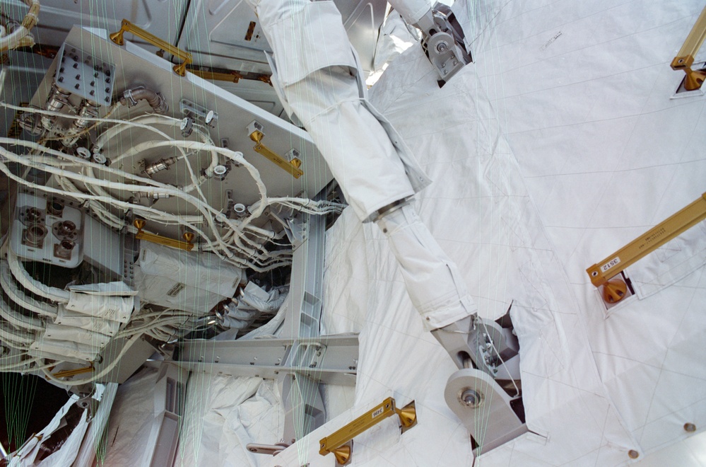 View of the aft avionics tray between the Z1 and S0 Trusses taken during the fourth EVA of STS-110