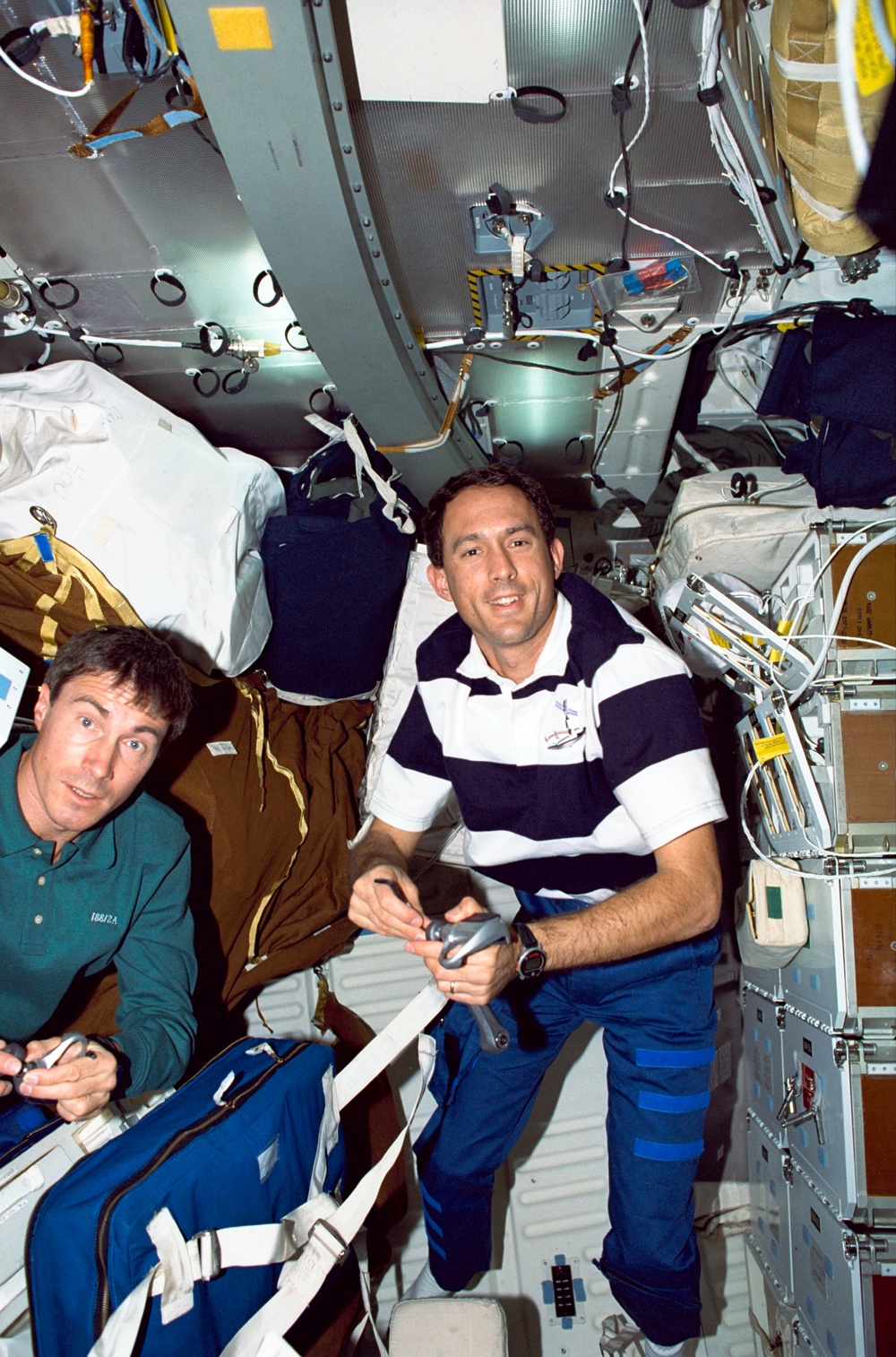 Various views of the STS-88 crew on the flight deck and middeck