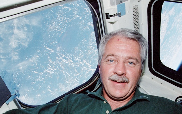 MS Phillips on the aft flight deck of Endeavour during STS-100