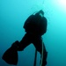 Navy diver surveys buoy