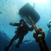 Navy diver surveys buoy