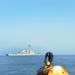 Navy diver surveys buoy