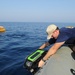 Navy diver surveys buoy