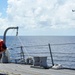 USS McCampbell sailor pulls line