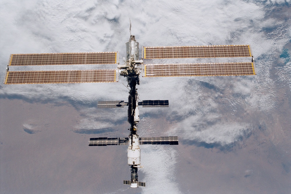 Various views of the ISS during flyaround backdropped by the Earth