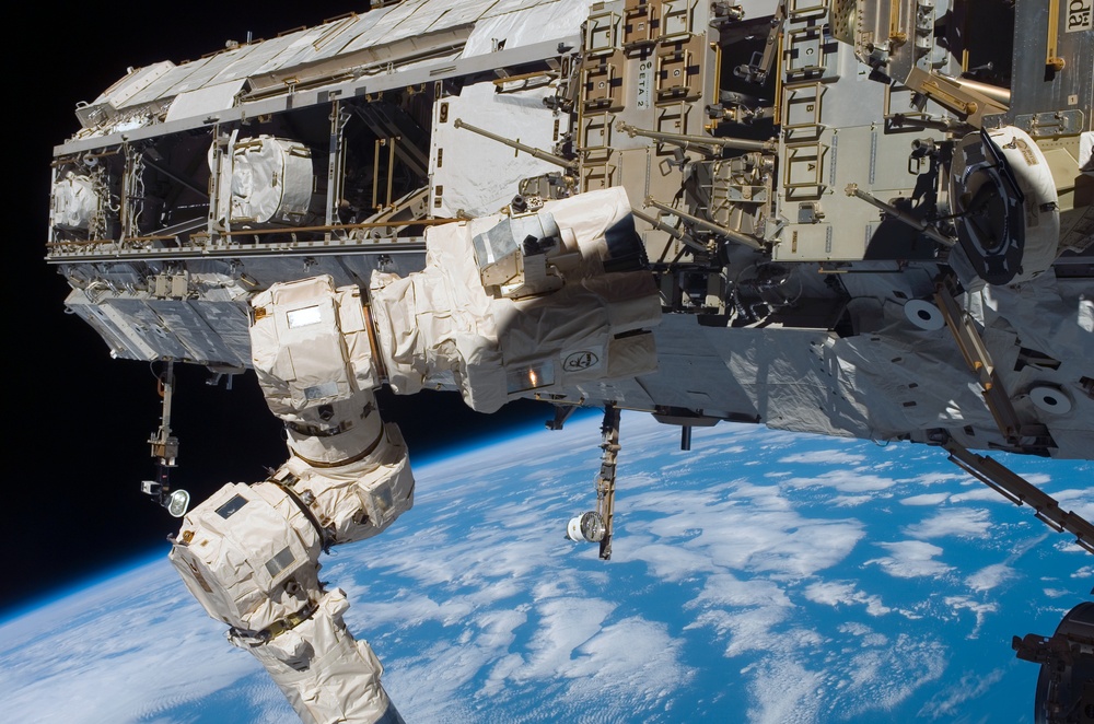 The SSRMS positions to grapple with the MBS during STS-121 / Expedition 13 joint operations