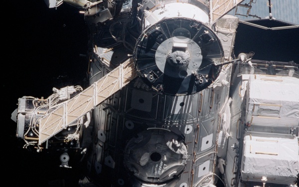 Exterior view of ISS during flyaround by STS-105 showing Node 1 and Airlock