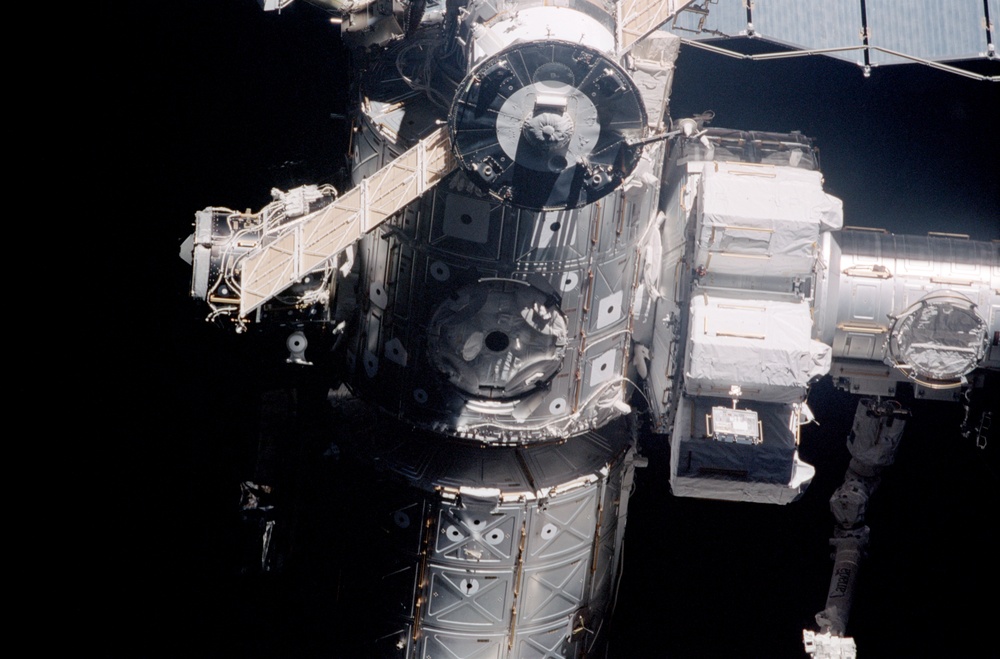 Exterior view of ISS during flyaround by STS-105 showing Node 1 and Airlock