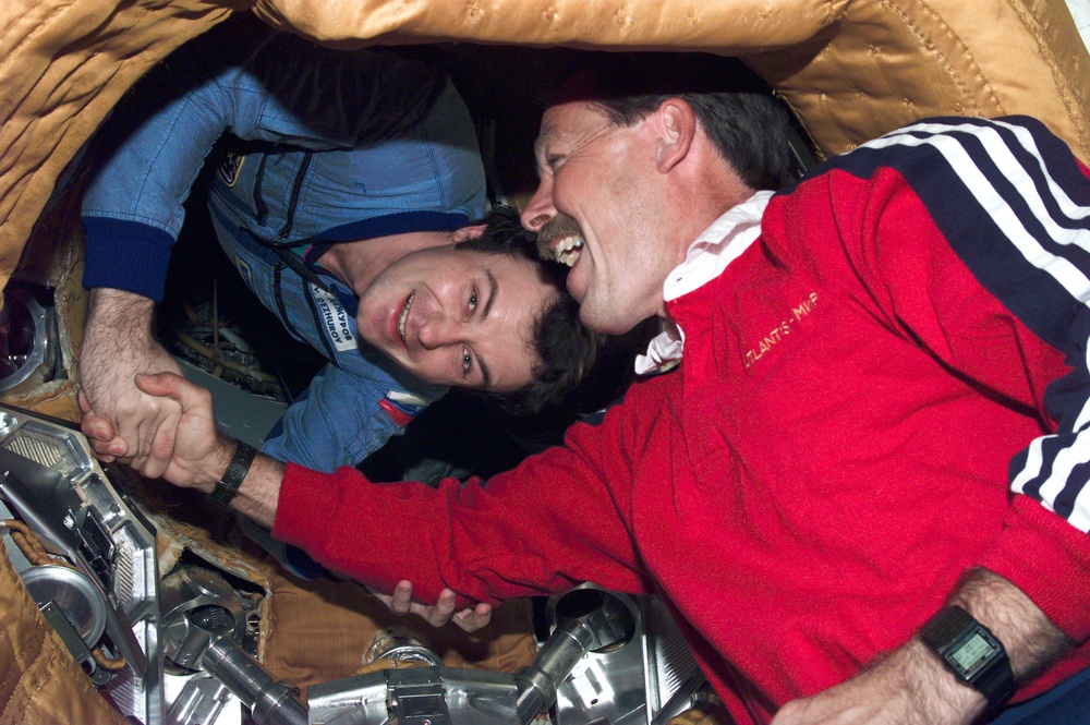 Astronaut Robert Gibson and Cosmonaut Vladimir Dezhurov greet