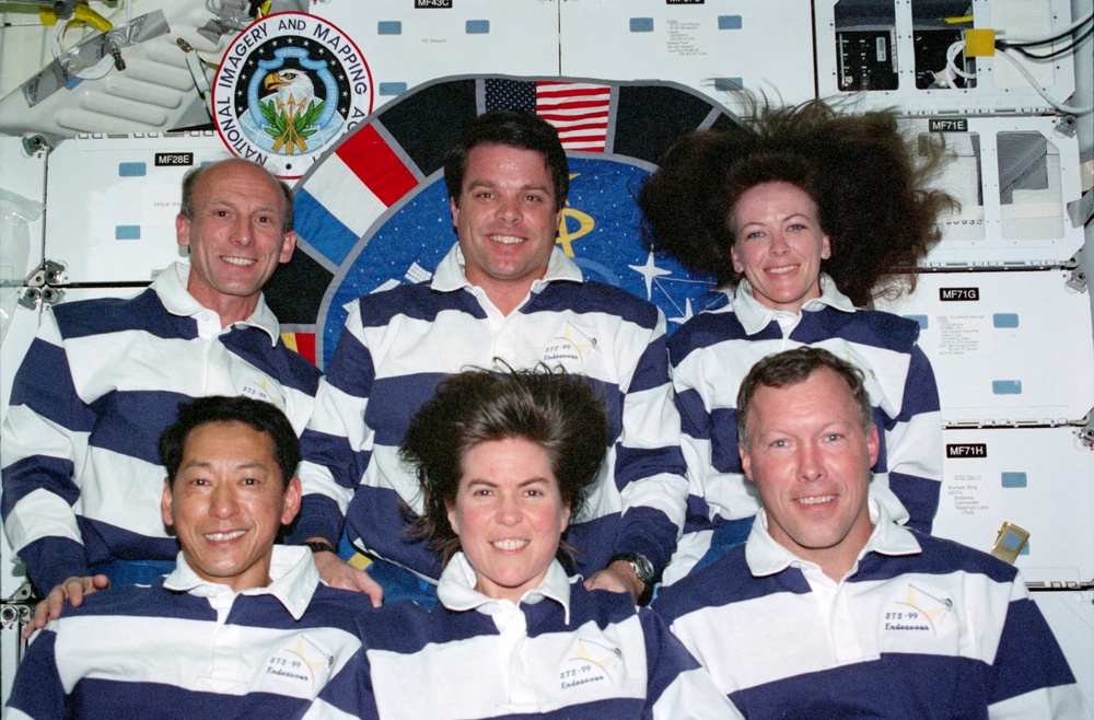 The STS-99 crew pose for their inflight portrait on OV-105's middeck