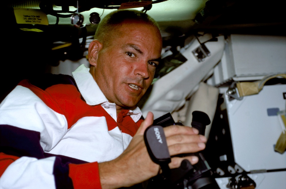 Sturckow with camera in the middeck