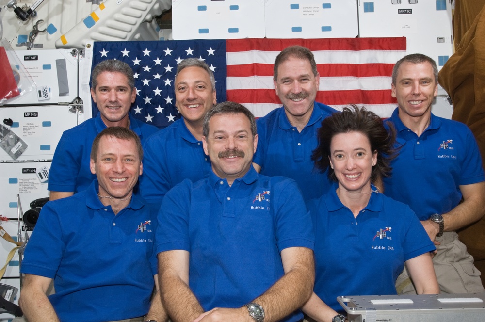 STS-125 Crew Members pose for a crew portrait on Atlantis' Middeck