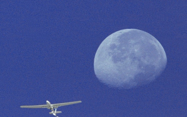 Perseus A in Flight with Moon