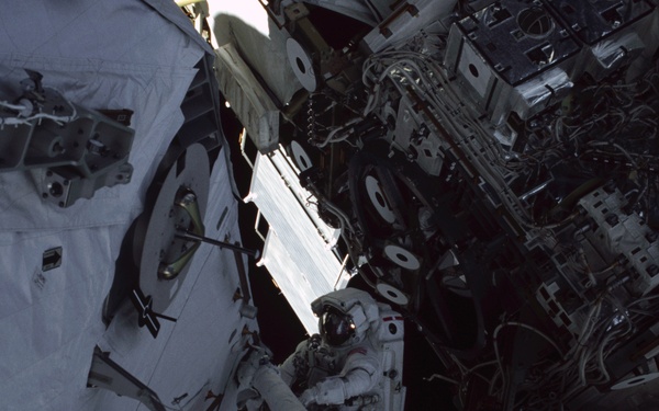 MS Ross works on the aft port struts for the S0 Truss during the second EVA of STS-110