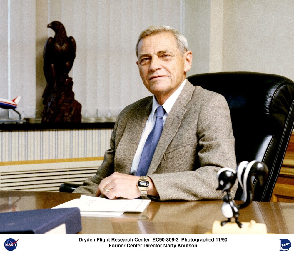 Martin A. Knutson seated at desk