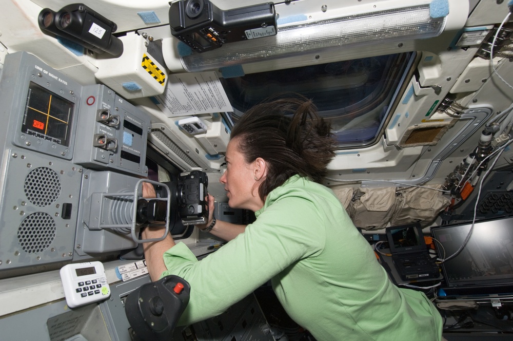 View of STS-125 MS2 Megan McArthur on the Atlantis Flight Deck during Flight Day 7