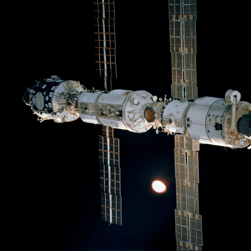 View of Zvezda, Zarya and Unity during the initial fly around of STS-106