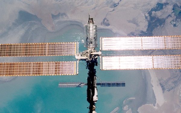 Various views of the ISS during flyaround backdropped by the Earth