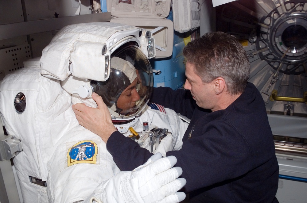 STS-115 MS Stefanyshyn-Piper is wearing her EMU in the Quest Airlock A/L on the ISS