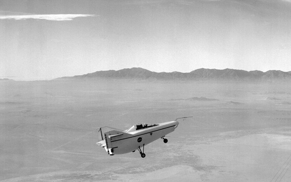 M2-F1 in flight over lakebed on tow line