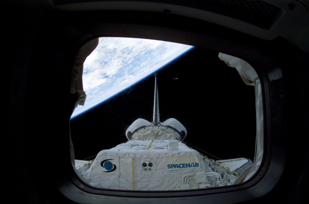Spacehab RDM framed by a window on Columbia's AFD during STS-107