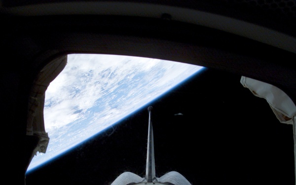 Spacehab RDM framed by a window on Columbia's AFD during STS-107