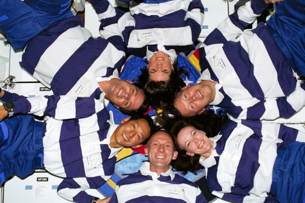 The STS-99 crew pose for their inflight portrait on OV-105's middeck