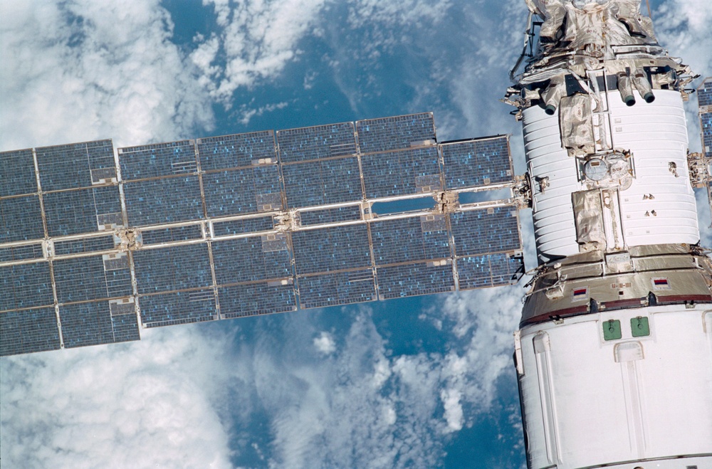 Exterior view of ISS during flyaround by STS-105 showing Service Module and Solar Array