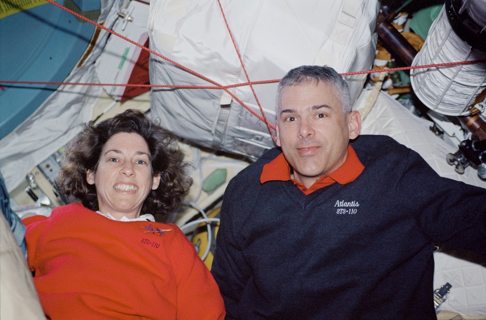 Morin and Ochoa pose in the Pirs Docking Compartment during STS-110