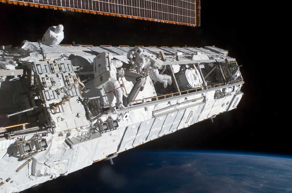 MS Lopez-Alegria and MS Herrington Keel Trunnion Pin OPS on P1 Truss during second EVA for STS-113