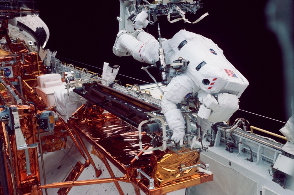 EVA 2 - old solar array installed in payload bay