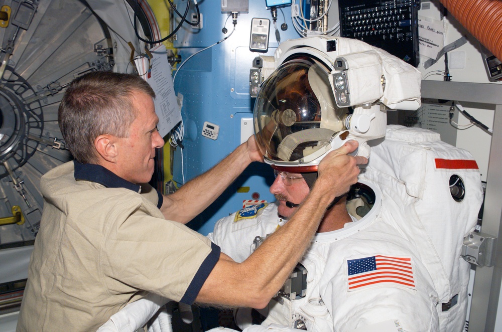 STS-115 MS Stefanyshyn-Piper is wearing her EMU in the Quest Airlock A/L of the ISS