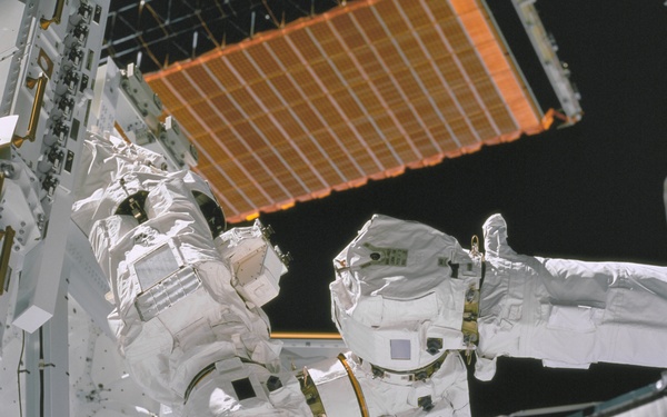 View of the newly installed SSRMS grappling the SLP taken during the STS-100 mission