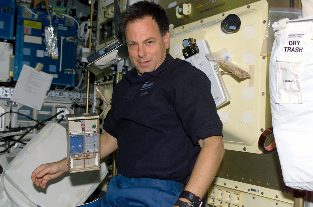 Ramon poses with 'The Chemical Garden' STARS payload in the SH during STS-107