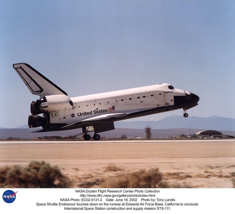 Space Shuttle Endeavour touches down on the runway at Edwards Air Force Base, California to conclude