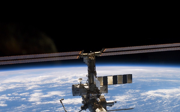 Aft - zenith view of the ISS taken during STS-110's undocking and final flyaround