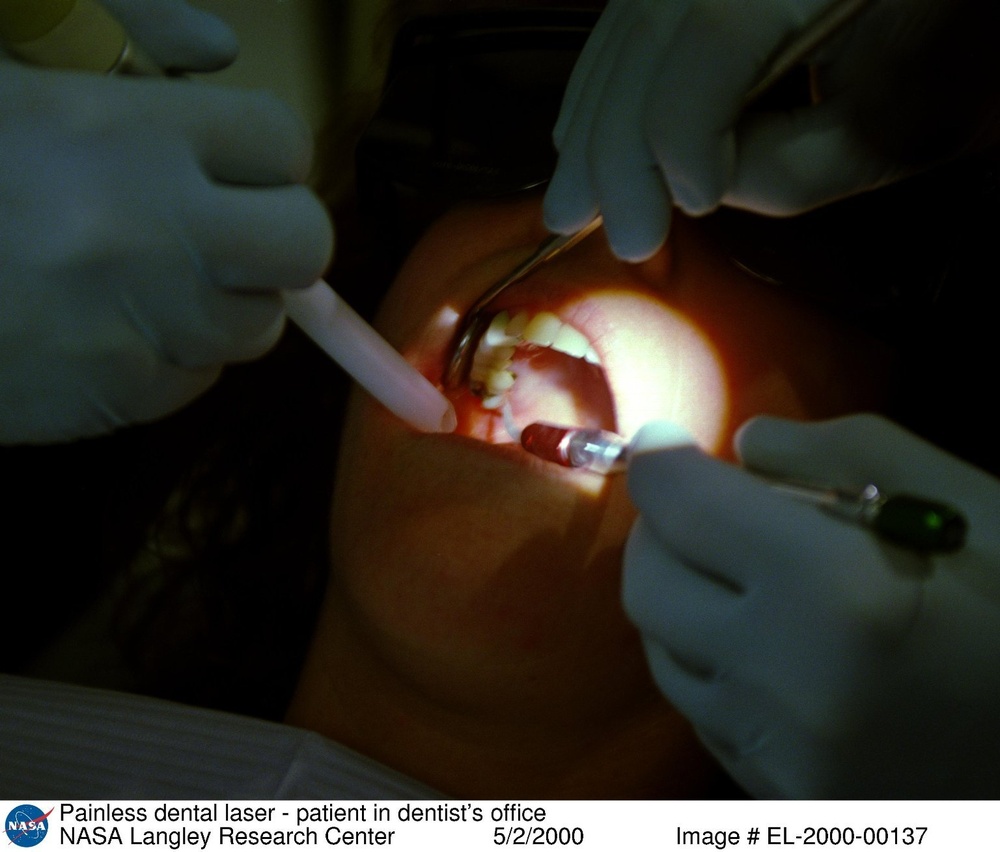 Painless dental laser - patient in dentist's office